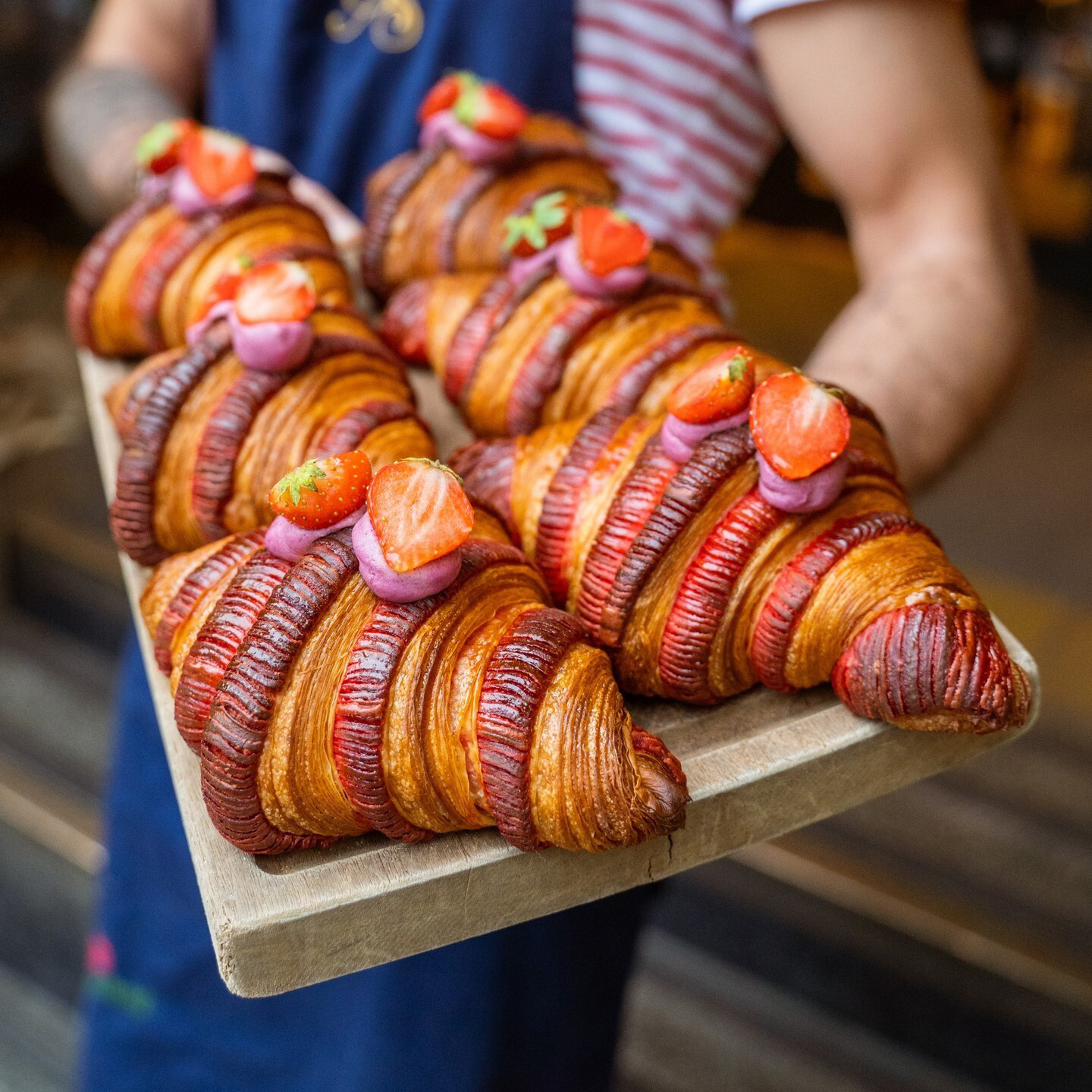 Large pastries topped with cream and strawberries from Albert's Schloss.