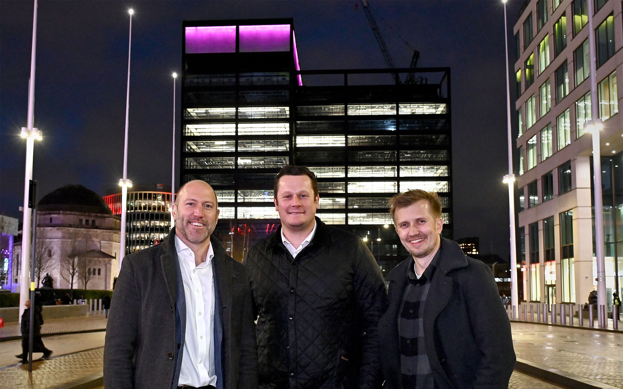 Developers responsible for the construction of One Centenary Way, Paradise Birmingham, standing on Broad Street with the building behind them.